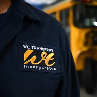 the wetransport logo on a shirt